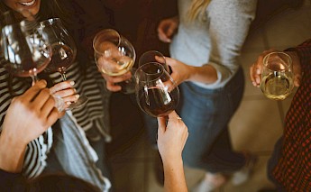Friends tasting wine, France. Kelsey Chance@Unsplash