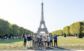 Group photo at the Eiffel Tower, Paris bike tour, France. CC:TO