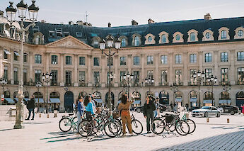 Listening to the guide, Paris bike tour, France. CC:TO