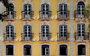 Beautiful yellow house along Alfama, Lisbon, Portugal. Thomas Peham@unsplash