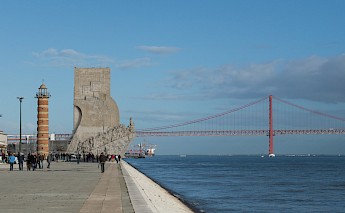 Tourists by the Monument of the Discoveries, Lisbon, Portugal. Red Mirror@unsplash