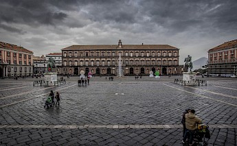 Gloomy day at the Piazza del Plebescito, Naples, Italy. N i c o l a@Wikimedia Commons
