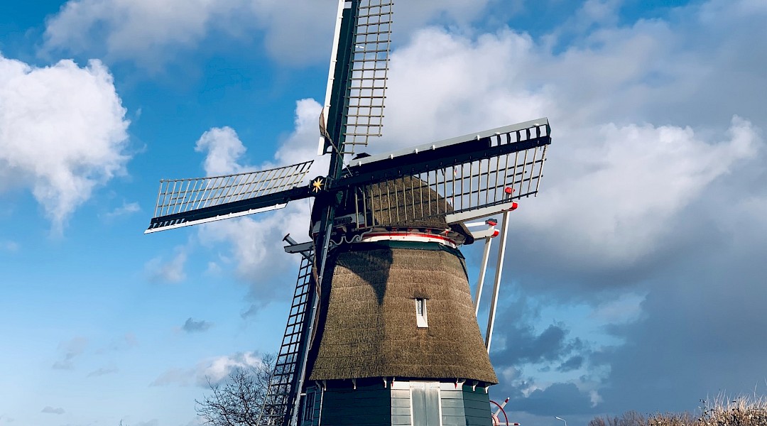dutch windmill under a clear sky, Utrecht, Holland. Anton S@Unsplash