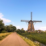 Windmill by the roadside in Utrecht, Holland. E Mens@Unsplash