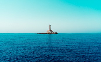Lighthouse out the coast of Cape Kamenjak, Premantura, Pula, Croatia. Samuel Schwendener@Unsplash