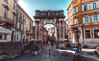Old and new architecture meeting on the streets of Old Town Pula, Croatia. Nick Kane@Unsplash