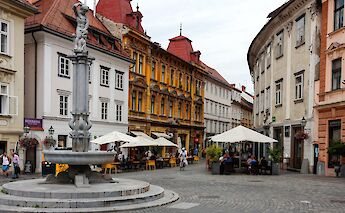 White and yellow buildings with red roofs, Ljubljana, Slovenia. Eugene Kuznetsov@Unsplash