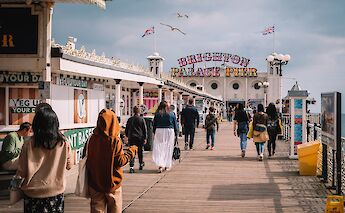 Seagulls soar over the Brighton Palace Pier, Brighton, England. Evgeny Kimenchenko@Unsplash