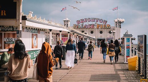 Seagulls soar over the Brighton Palace Pier, Brighton, England. Evgeny Kimenchenko@Unsplash
