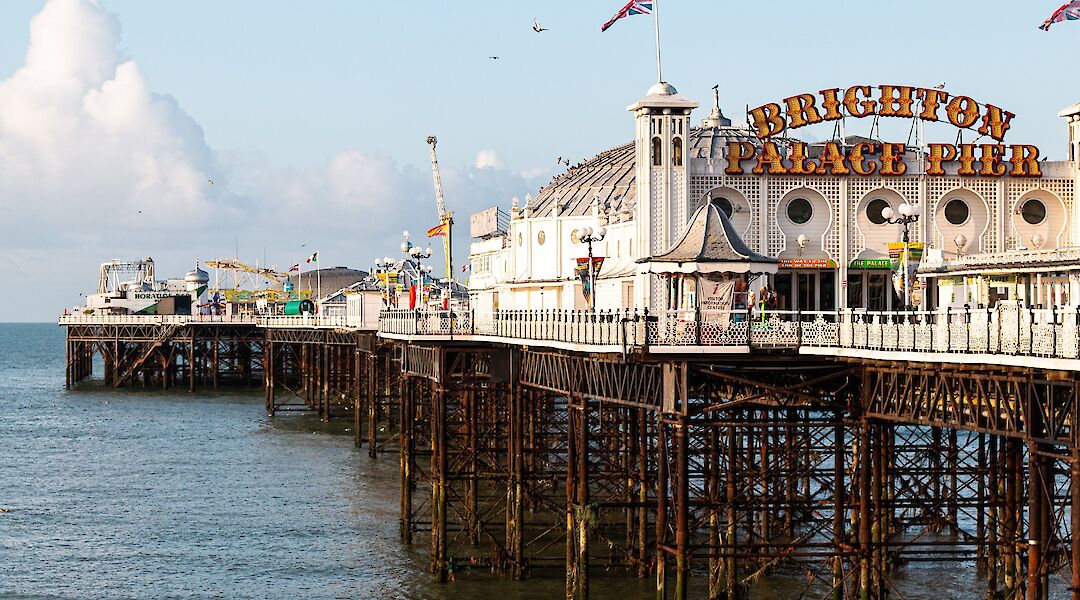 Brighton Palace Pier, established in 1899, it was the third pier to be constructed in Brighton after the Royal Suspension Chain Pier and the West Pier, but is now the only one still in operation, Brighton, England. Veerle Contant@Unsplash