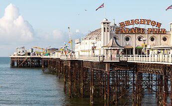 Brighton Palace Pier, established in 1899, it was the third pier to be constructed in Brighton after the Royal Suspension Chain Pier and the West Pier, but is now the only one still in operation, Brighton, England. Veerle Contant@Unsplash