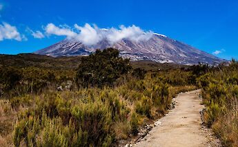 Clouds fronting Mount Kilimanjaro, Kilimanjaro, Tanzania. Crispin Jones@Unsplash