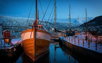 Boats anchored at the hardbor, Tromso, Norway. Vidar Nordli Mathisen@Unsplash