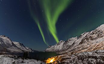 Northern lights over Tromso, Norway. Bjorn are with Andreassen@Unsplash