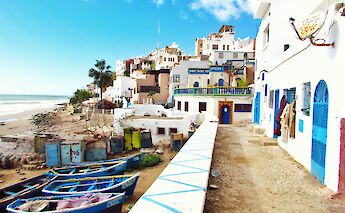Boats on the beach in Taghazout, Morocco. Unsplash@Louis Hansel