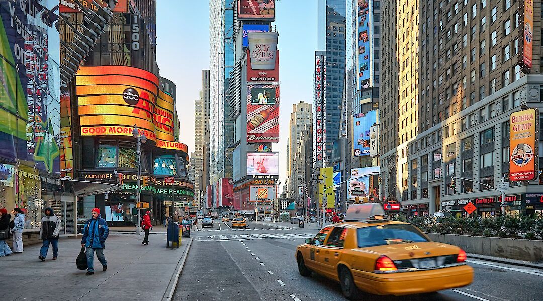 Yellow taxi driving through Times Square, New York, New York. Vidar Nordli-Mathisen@Unsplash