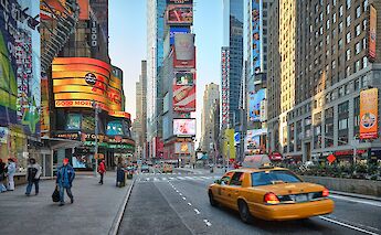 Yellow taxi driving through Times Square, New York, New York. Vidar Nordli-Mathisen@Unsplash
