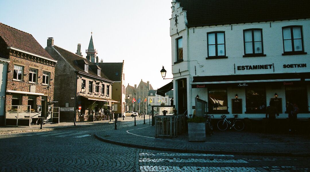 Cobblestone road fronting a small shop, Damme, Belgium. Mark Pecar@Unsplash