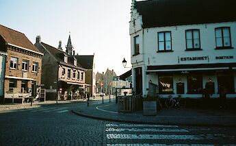 Cobblestone road fronting a small shop, Damme, Belgium. Mark Pecar@Unsplash