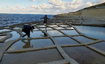 Children playing on the salt pans, Gozo, Malta. Hasmik Ghazaryan Olson@Unsplash