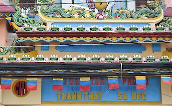 Decoration on Cao Dai Temple, Vietnam. Anne and David@Flickr