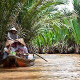 Tour guide sharing stories to her tourists through the river tour, Mekong River Delta, Ho Chi Minh City, Vietnam. Tomas Malik@Unsplash