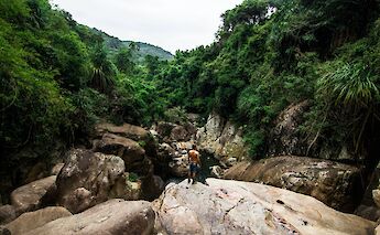 Rocks above a river in a Vietnamese Jungle, Ho Chi Minh City, Vietnam. Julan Hanslmaier@Unsplash