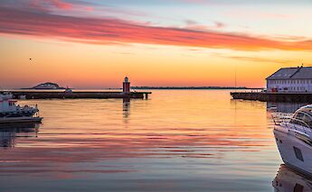 Boats in harbour in golden hour, Alesund. Mike Benna@Unsplash