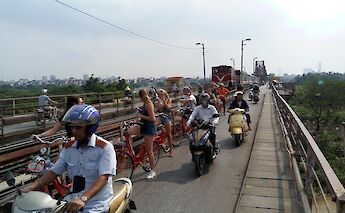 Bike tour of Long Bien Bridge, Hanoi, Vietnam. CC:Friends Travel Vietnam