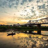 Picturesque sunset showcasing the Long Bien Bridge in Hanoi, Vietnam. Dzung S@Unsplash