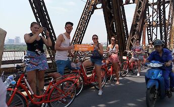 Posing with the bikes on a tour of Long Bien Bridge, Hanoi, Vietnam. CC:Friends Travel Vietnam