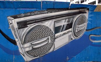 Stereo Graffiti by Eindhoven, Street art in the Hague, Holland. FaceMePLS@Wikimedia Commons