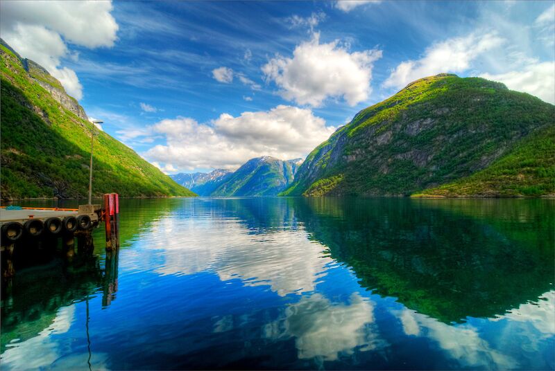 Reflections of the hills on the lake, hellesylt, Norway. Avery Ng@Flickr (CC-BY-SA-2.0)