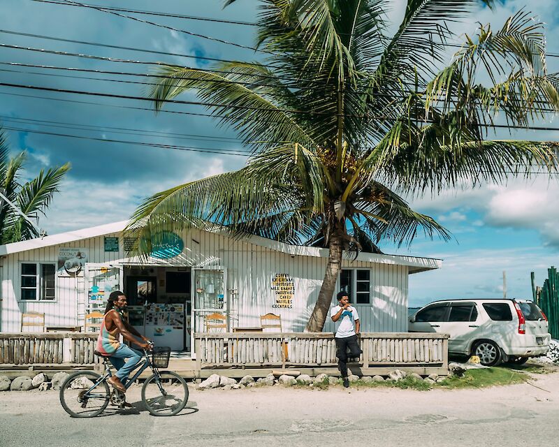 Man riding a bike in Negril, Jamaica. Rock Staar@Unsplash