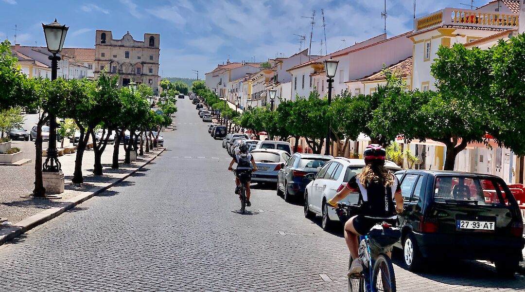 A cyclist on a quiet street in the Alentejo, Portugal