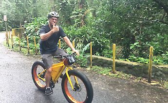 Biking on the trail to Manoa Falls, Honolulu, Hawaii.