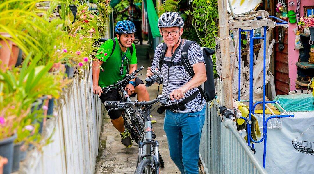 Bikers on a footpath, Bangkok, Thailand. Grasshopper Day tours