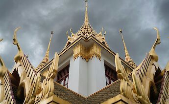Storm clouds above a temple, Bangkok, Thailand. Markus Winkler@Unsplash