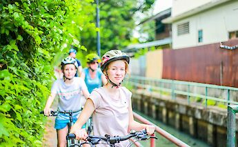Biking through the side roads of Bangkok, Thailand. Grasshopper Day Tours