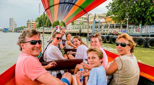 Boat ride through the canal, Bangkok, Thailand. Grasshopper Day Tours