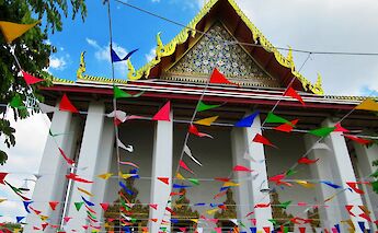 Bunting outside a temple, Bangkok, Thailand. Jennifer Griffin Fu@Unsplash