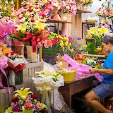 Flower stand busy at night in Bangkok, Thailand. Grasshopper Day Tours