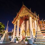 White and gold temple at night, Bangkok, Thailand. Grasshopper Day Tours