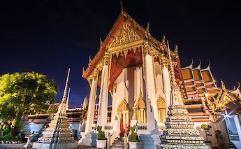 White and gold temple at night, Bangkok, Thailand. CC:Grasshopper Day Tours