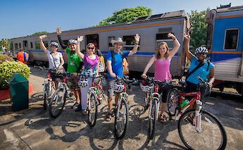 Bike Tourists by the train, Chiang Mai, Thailand. Grasshopper Day Tours