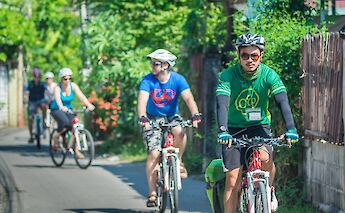 Biking through the neighborhood, Chiang Mai, Thailand. Grasshopper Day Tours