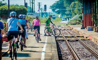 Crossing a railway with bikes in Chiang Mai, Thailand. Grasshopper Day Tours