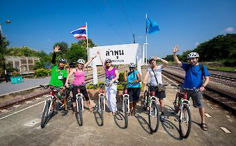 Stopping for a picture at a sign in Lamphun, Chiang Mai, Thailand. Grasshopper Day Tours