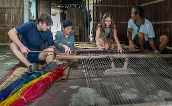 Learning the art of weaving, Hoi An, Vietnam. Grasshopper Day Tours