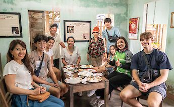 Enjoying local cuisine at Hoi An, Vietnam. Grasshopper Day Tours